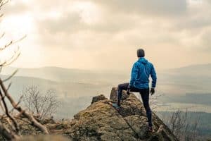 Image of a man hiking free of anxiety symptoms in North Carolina. An anxiety therapist can help you get there too. Physical symptoms of anxiety don't have to control your life. Get started in anxiety treatment in Asheville, NC 28746. Call today! 28730 | 28745 | 28732