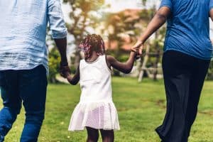 Image of an African American family of 3 walking hand in hand. Having access to BIPOC mental health resources in North Carolina is important. Our online therapist in North Carolina can help you from Fayetteville, Raleigh, Asheville or anywhere in the state. Reach out today to start multicultural counseling in Asheville, North Carolina.