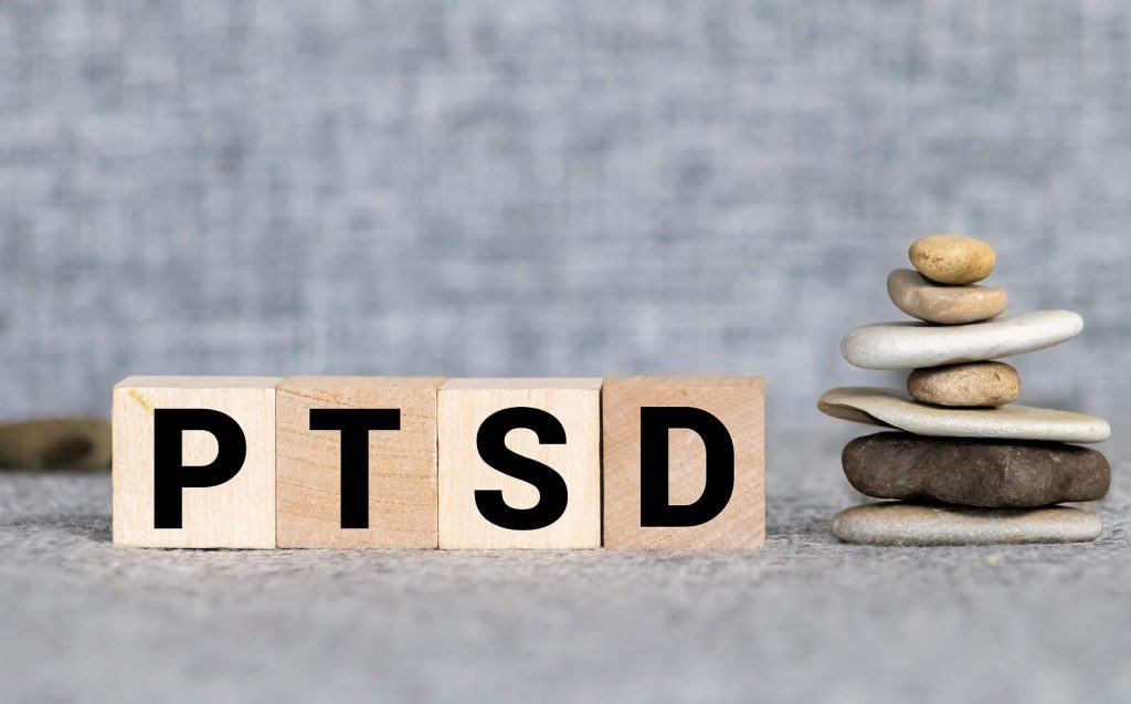 Image of PTSD spelled out in wood blocks