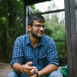 a man sitting outside and smiling depression treatment