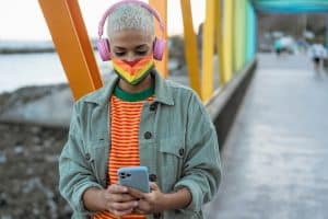 Image of a person on a rainbow colored bridge with a rainbow mask. LGBTQIA+ therapy is a place for you to express yourself freely. Are you ready to open up to a LGBTQ+ affirming therapist. We are here for you with LGBTQ friendly therapists in North Carolina. Whether you are in Asheville, Wilmington, or in rural North Carolina. Call today!